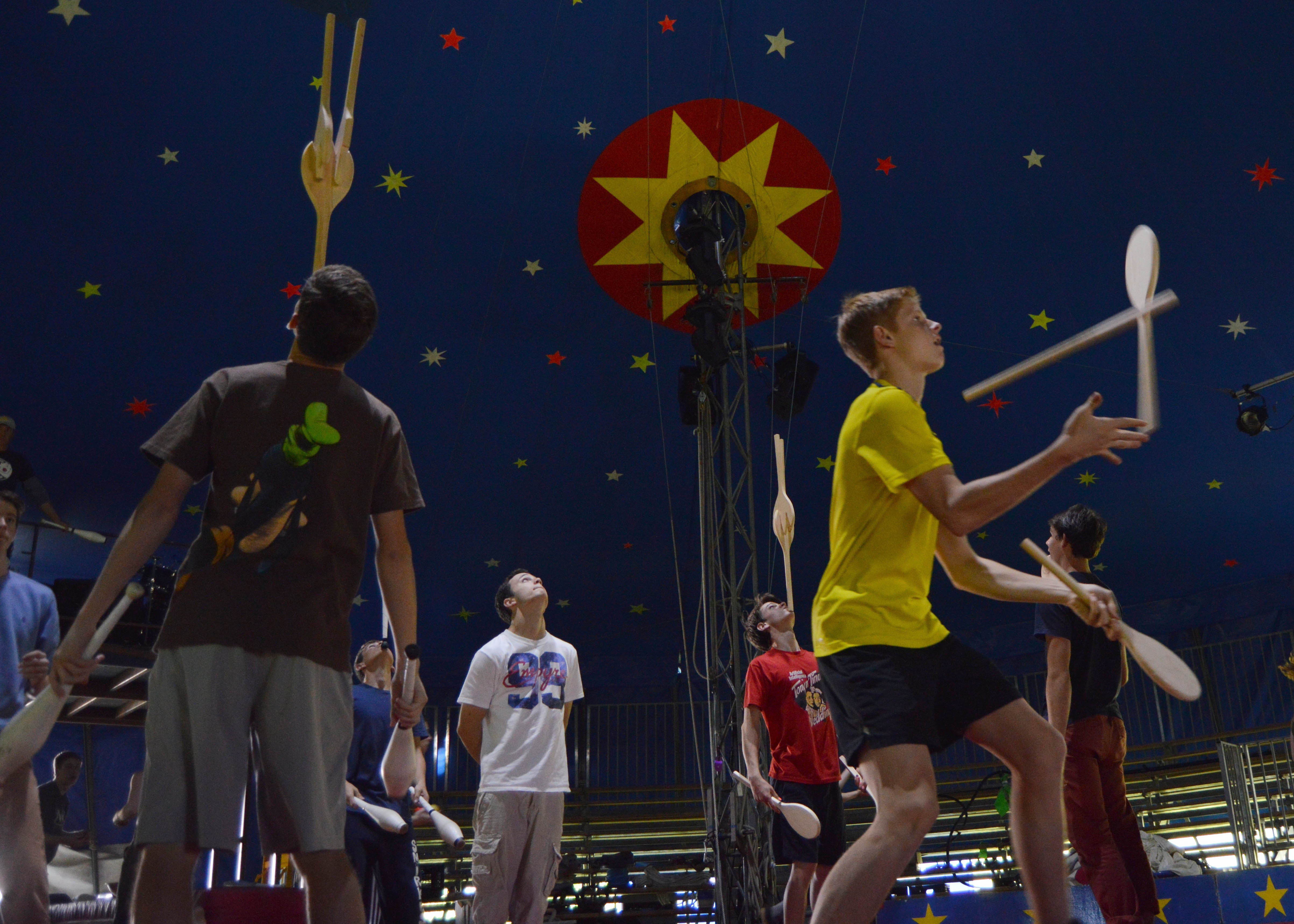 Wesely is wearing the yellow shirt and rehearsing an intense juggling sequence.