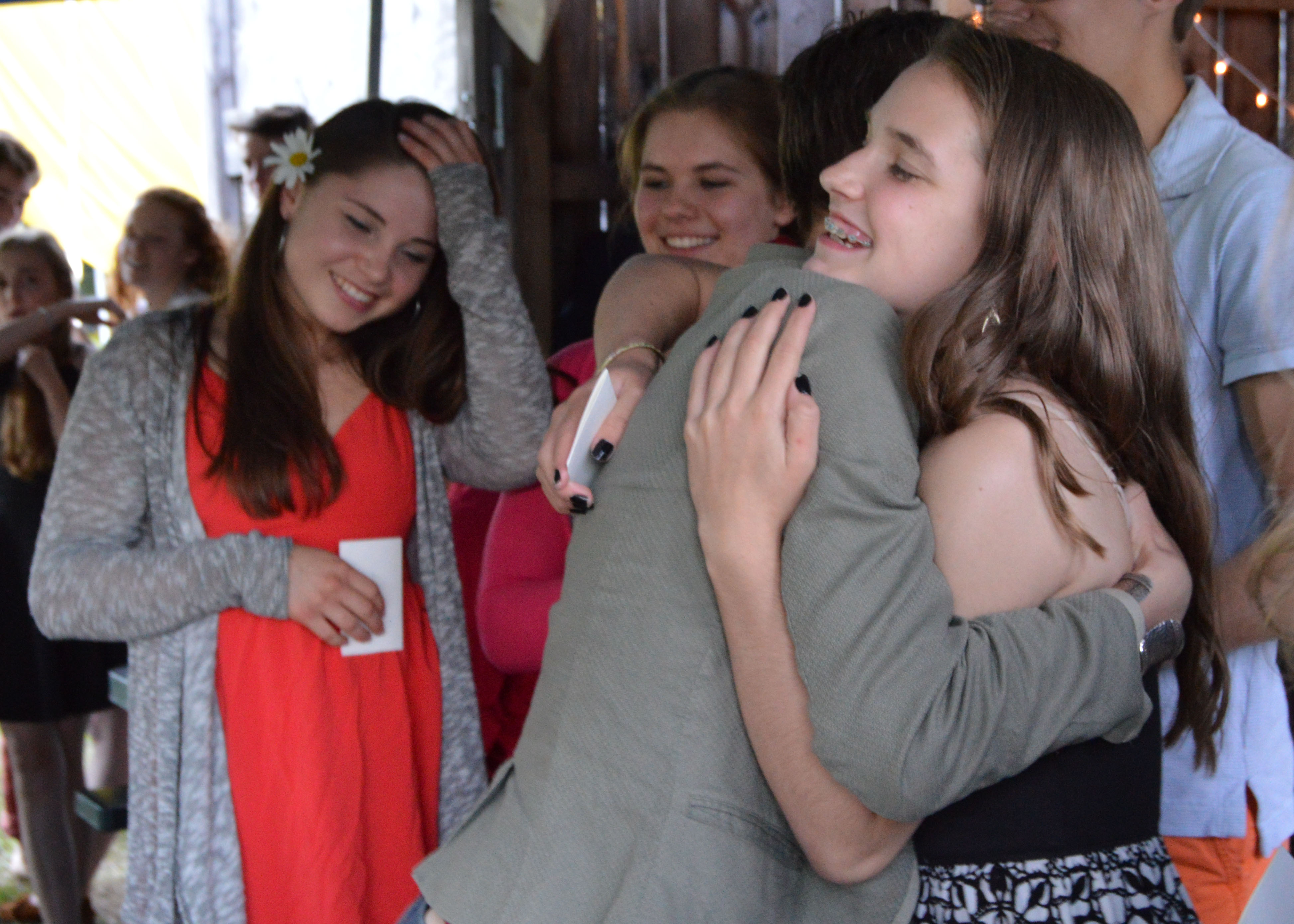 Coach Alisan Funk and Trouper Sandy Kelso hug at the 2015 Smirkus Banquet.