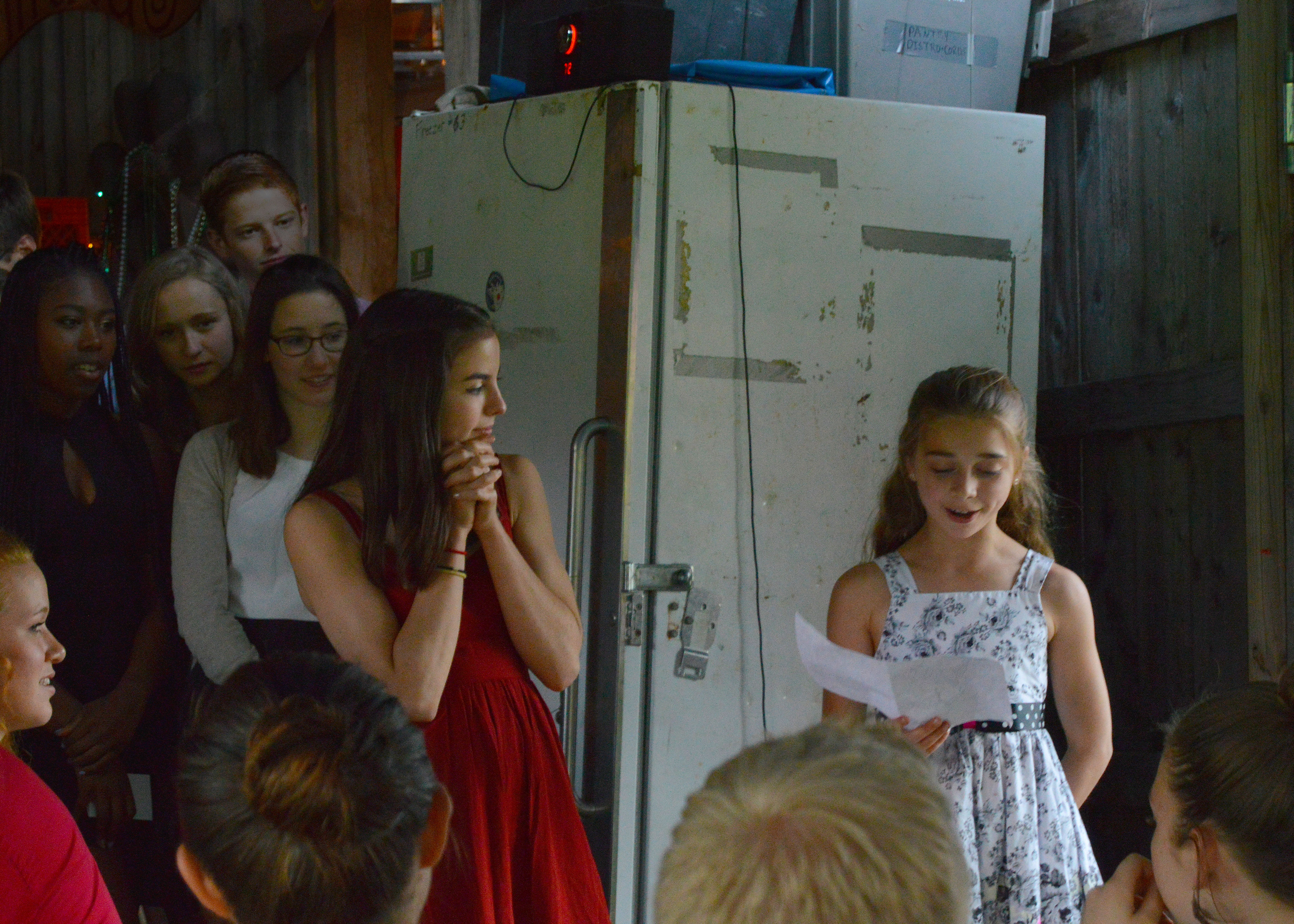 Troupers Lola Picayo and Ariana Wunderle give a warm thanks to their coaches at the 2015 Smirkus Banquet.