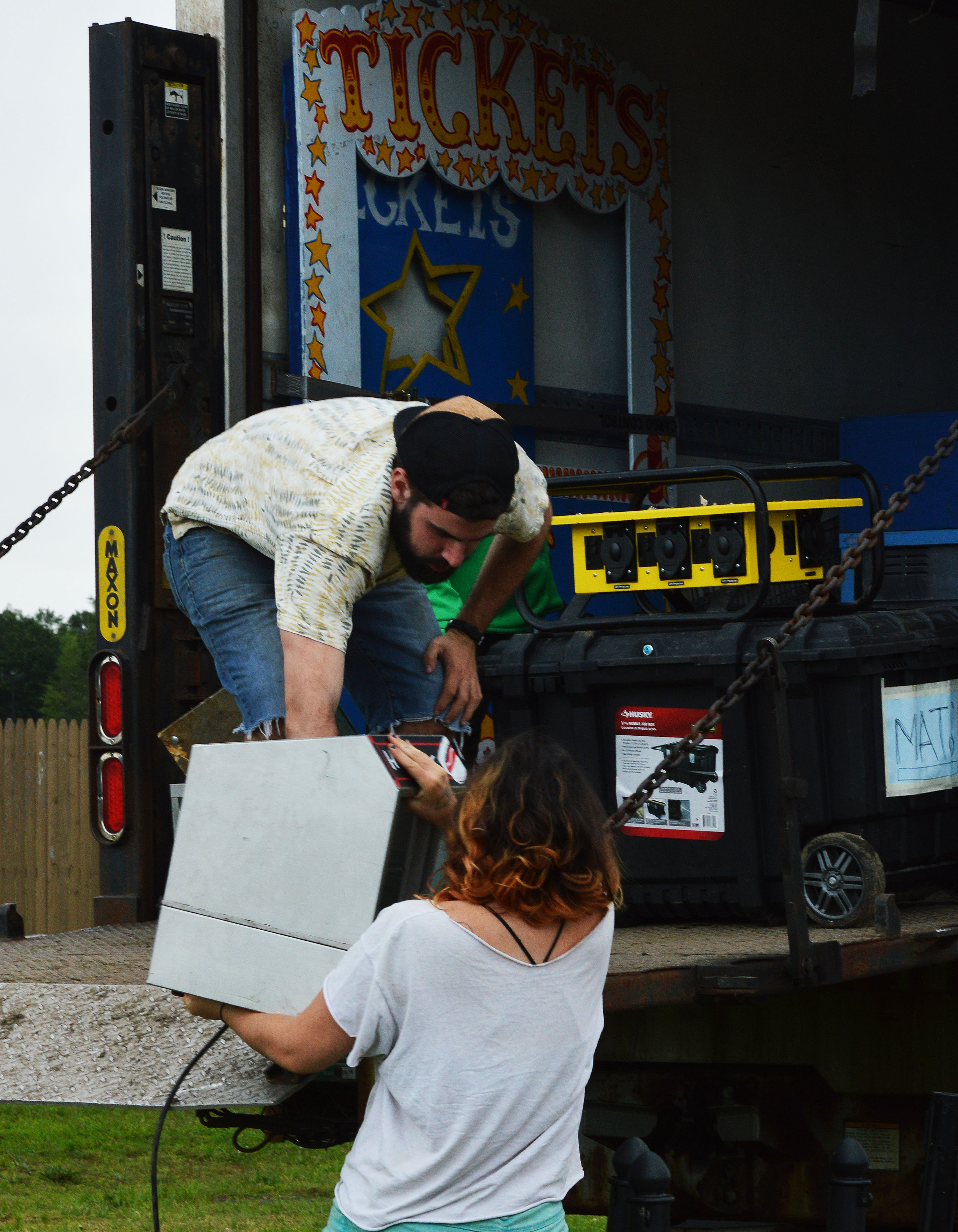 Members of our concessions team, Hannah Herrod and Kevin Hovanic unloading the truck to set up Millie (concessions tent).